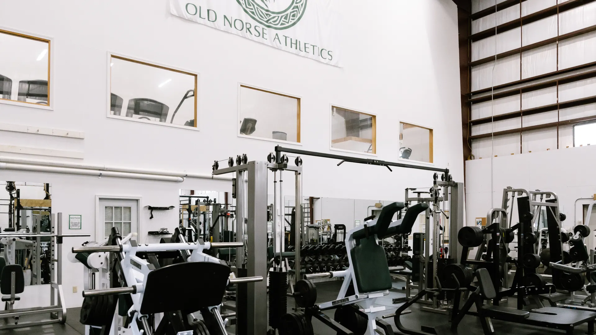 Member training at a power rack during late-hour open gym access at O.N. Athletics in Groton, CT