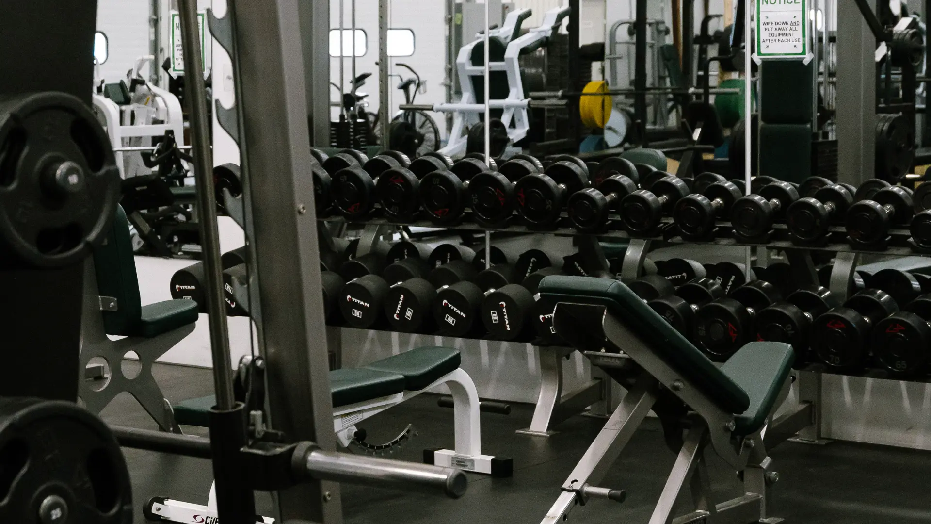 Dumbbell racks and adjustable benches on the free weight floor at O.N. Athletics in Groton, CT