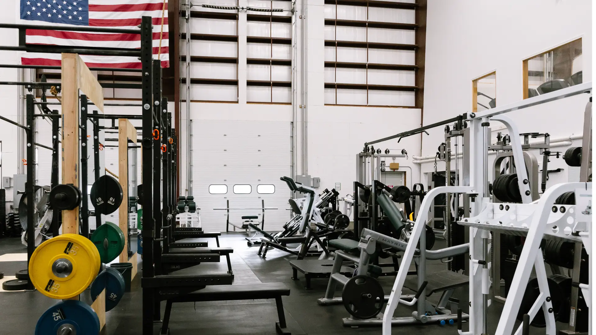 Power racks, plates and selectorized machines on the open gym floor at O.N. Athletics in Groton, CT