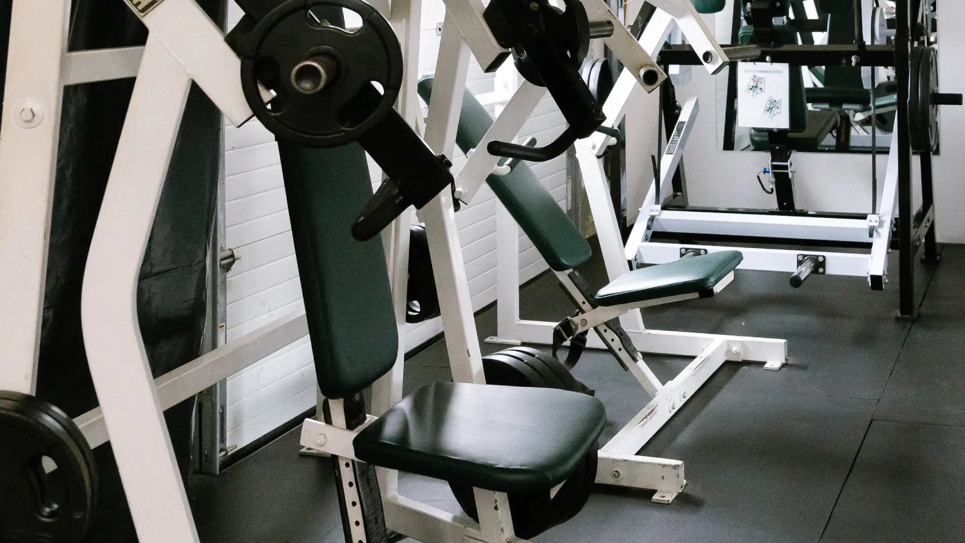 Hammer strength style plate-loaded chest and shoulder machines at O.N. Athletics in Groton, CT