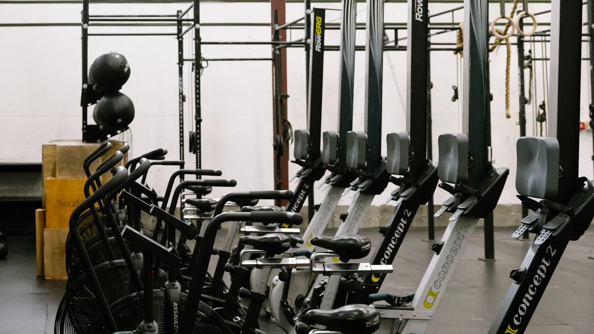 Concept 2 rowers and assault bikes in the conditioning row at O.N. Athletics in Groton, CT