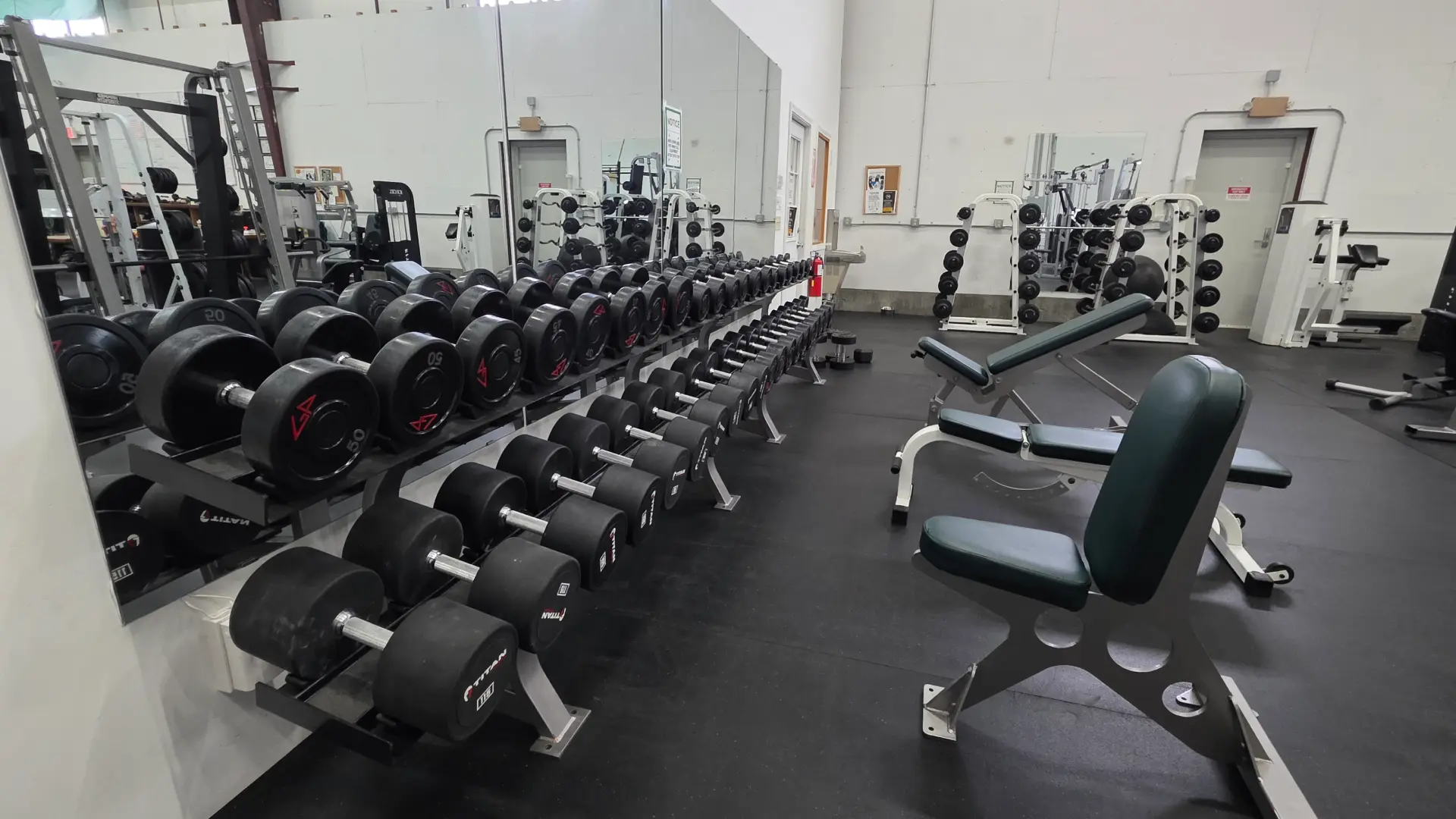 Full dumbbell rack and adjustable benches at O.N. Athletics in Groton, CT