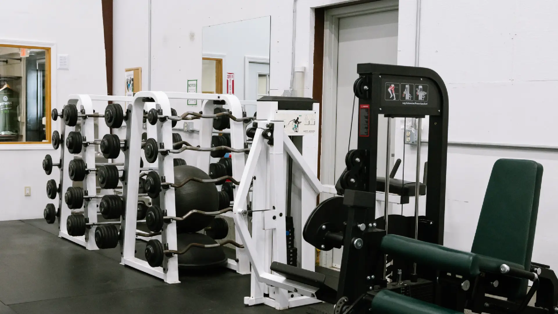 Preset curl bars and selectorized leg machines at O.N. Athletics in Groton, CT
