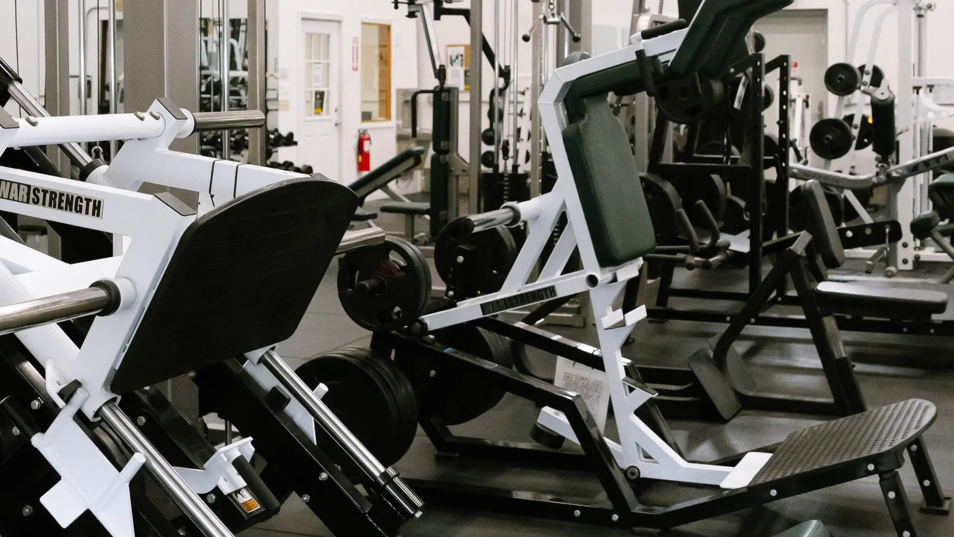 Plate-loaded leg press and hack squat machines at O.N. Athletics in Groton, CT
