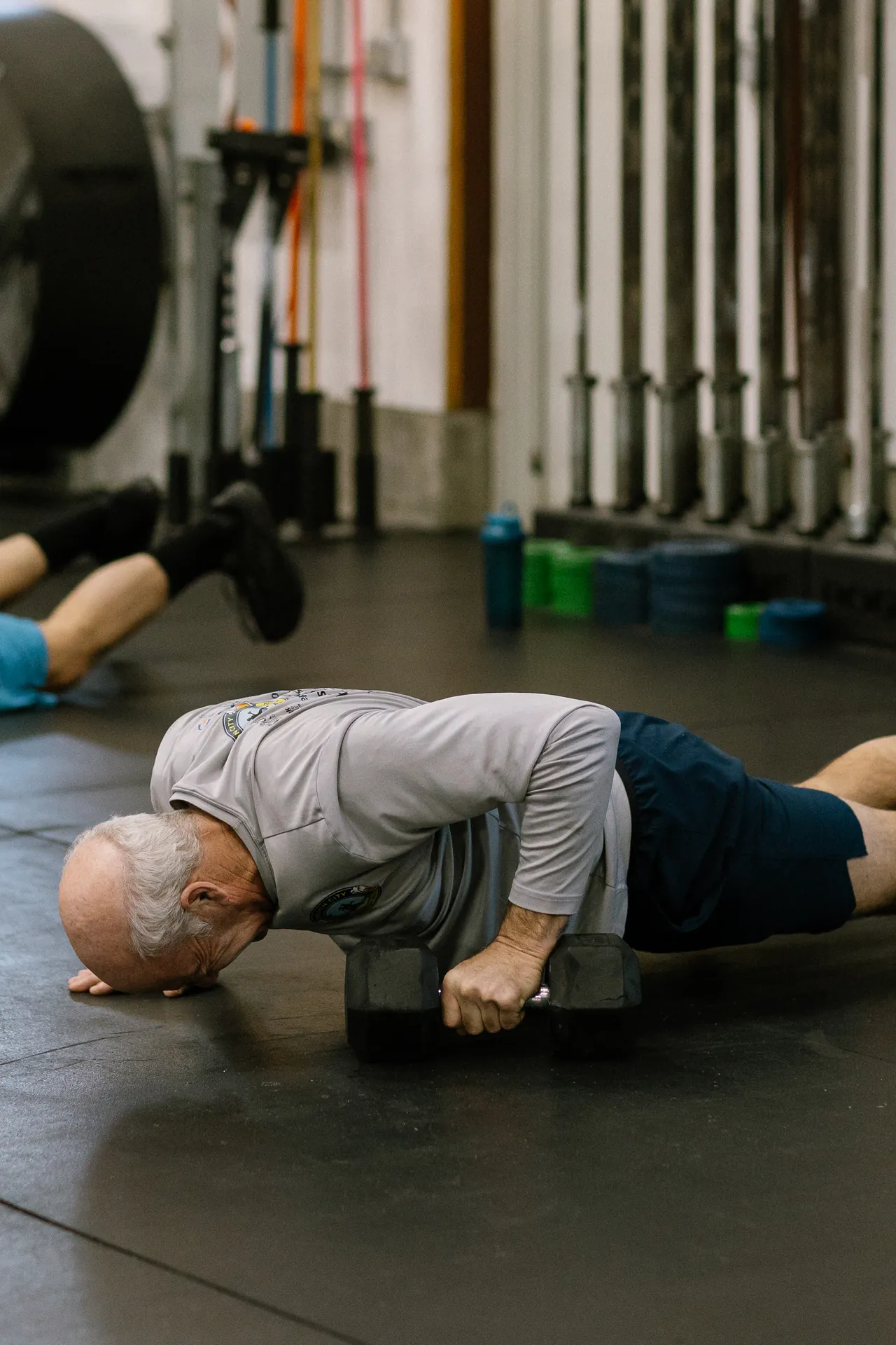 Athlete resetting between sets on the training floor at CrossFit Dýr in Mystic, CT