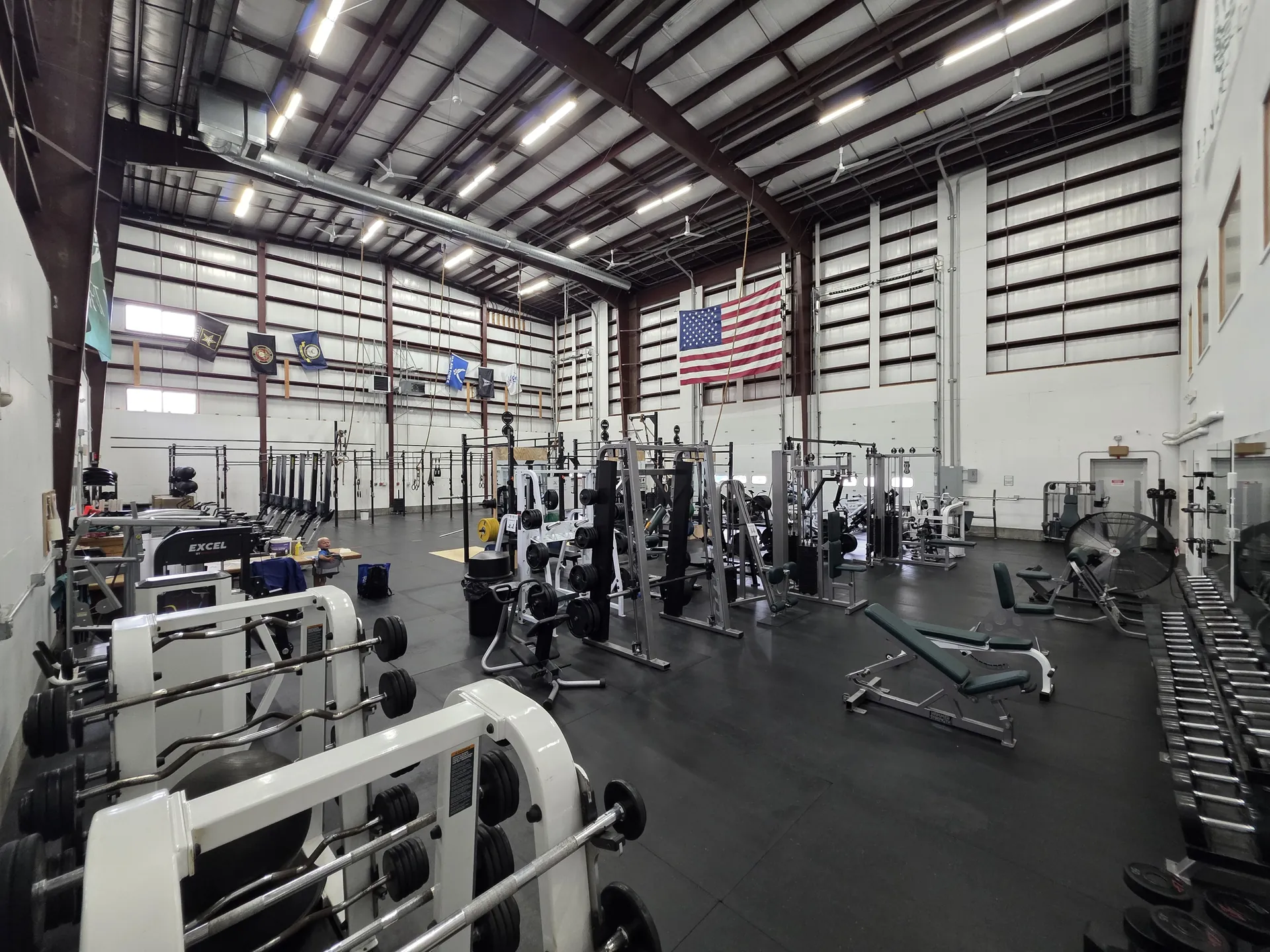 Rows of cardio machines and the open 24/7 training floor at O.N. Athletics in Mystic, CT